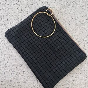 Rebecca Norman Wrist Black Grid Pattern Clutch NWOT. Soft black Leather